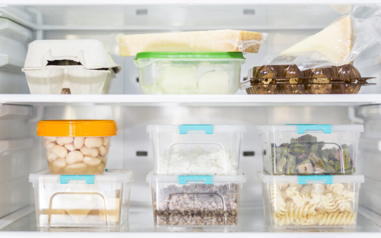 front-view-organized-plastic-food-containers-fridge